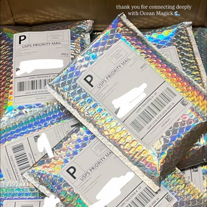 Stack of USPS Priority Mail packages with colorful labels.